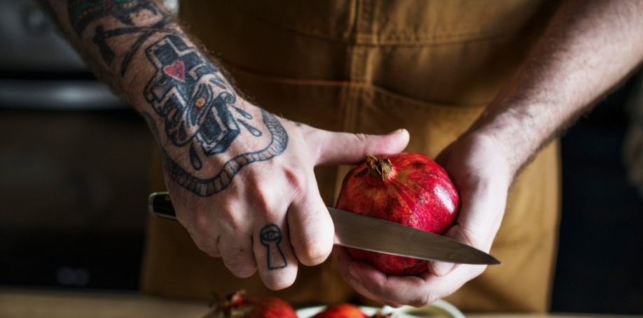 private chef cutting a pomegranate