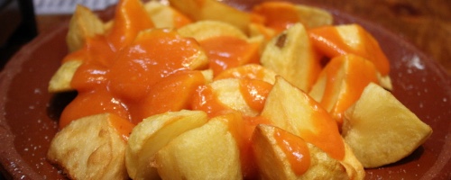 Patatas bravas (pan fried potatoes with spicy sauce)