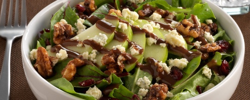 Tossed green salad with candied walnuts, apple slices..