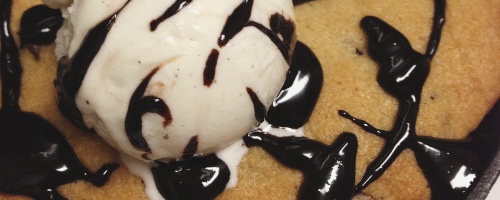 Chocolate chip cookie with vanilla ice cream on top