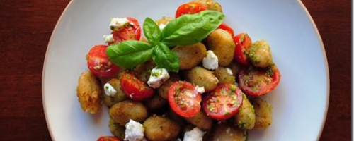 Crispy pesto gnocchi with cherry tomatoes and goats cheese
