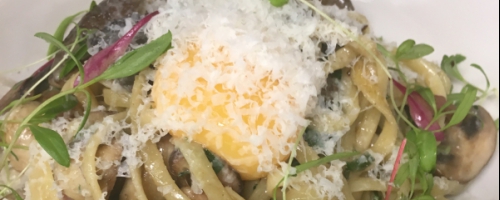Prosciutto and mushroom linguini with soft yolk and pecorino
