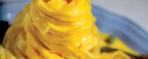 Saffron pasta with spiced butter,sundry tomato, asp
