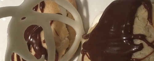 Cream Puffs with chocolate ganache and white chocolate twirl