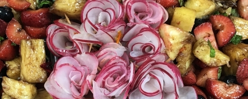 Fresh fruit with balsamic and mint with radish roses