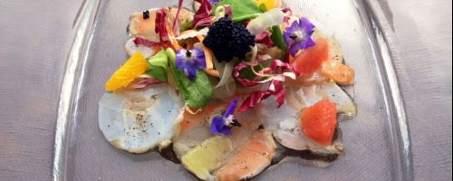 Mix carpaccio with cavia and  citrus fruits