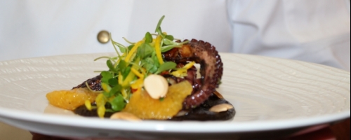 Grilled Octopus, squid ink Mole, citrus salad, salted almon