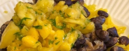 Black bean chili on yellow rice with mango-cilantro relish