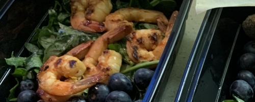 Grilled shrimp with arugula and seasonal berries