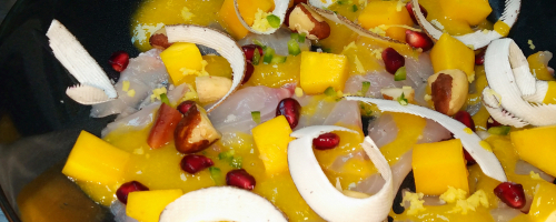 Ceviche de loup avec coulis de mangue