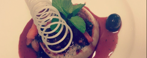 Vanila panacota served with wild berry sauce