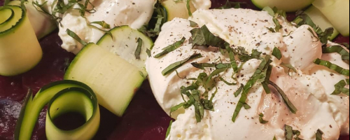 Fresh burrata on a beet carpaccio