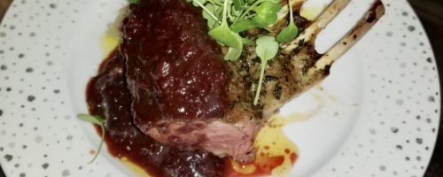 Herb crusted  Rack of Lamb with red wine berry sauce