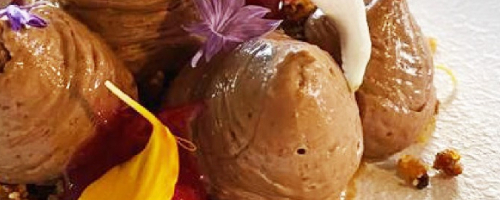 Rich belgian choccolate mousse, almond crumble, and orange p