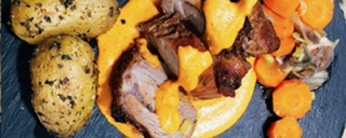 Solomillo de cerdo asado, salsa romesco y vegetales