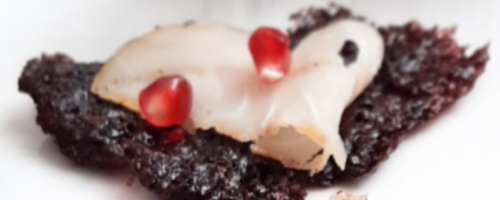 Crispy black rice wafer with San Marzano tomato tartare and