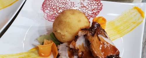 Jerk pork tenderloin, creamy stuffed potatoes  saute vegetab
