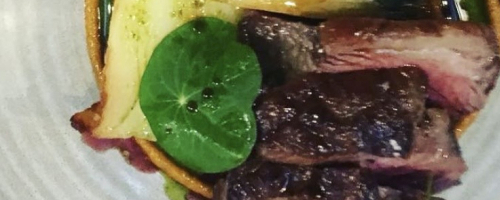 Ember‑Roasted Lamb   Coal Jus • Blackened Roots